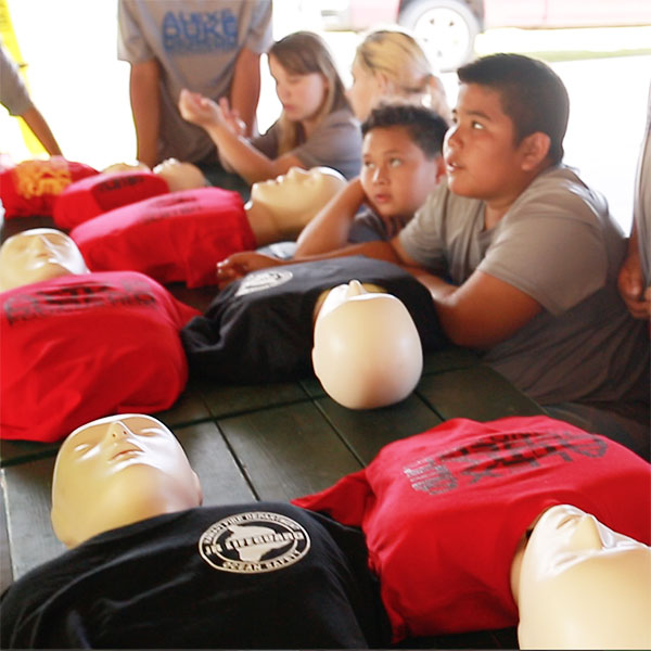 students learn cpr on dummies